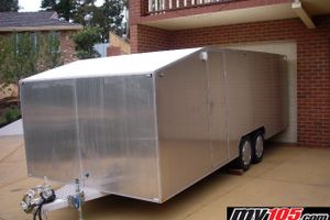 Enclosed Tandem trailer.